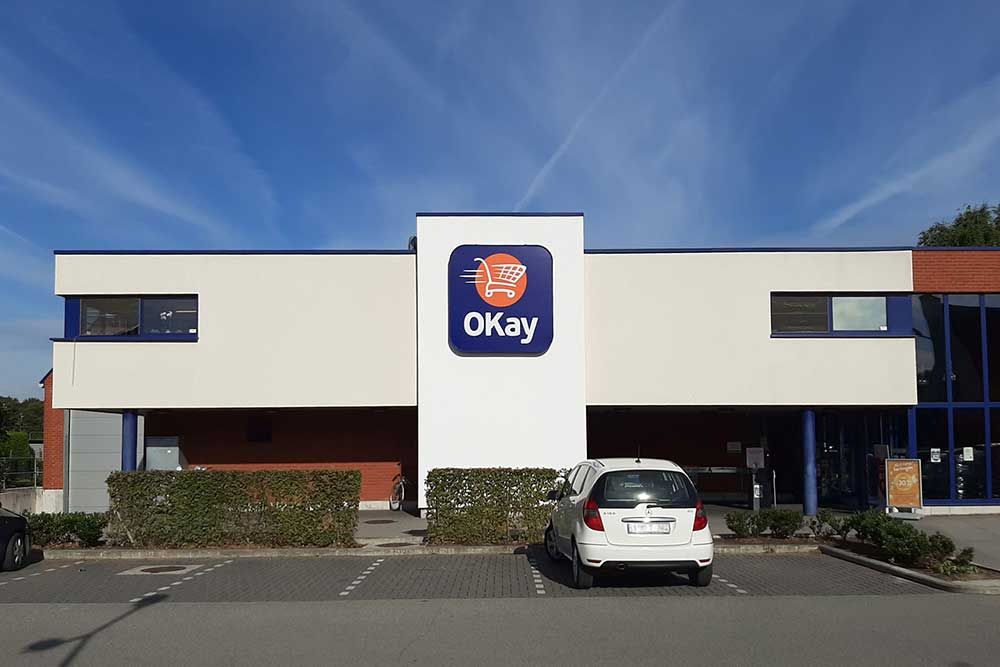 Eerste grootschalig Belgisch project met luchtzuiverende gevelverf bij winkelketen OKay